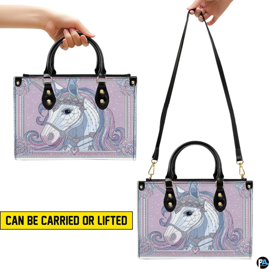 Matching unicorn wallet lying flat displaying the coordinating crowned unicorn artwork.