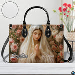 Front view of ivory veil Virgin Mary handbag showing rose floral print with texture circle