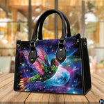 Handbag standing upright on wooden tabletop in softly lit indoor room.