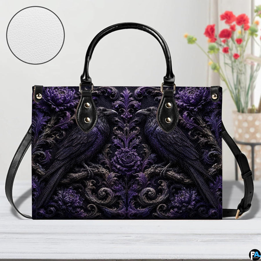 Tabletop setting presenting the gothic raven art accessory next to indoor floral blooms.