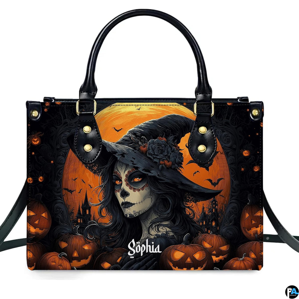 Halloween witch handbag and wallet displayed on wooden table beside potted plant.