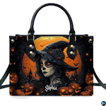 Halloween witch handbag and wallet displayed on wooden table beside potted plant.