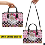 Dual display showing handheld carrying and shoulder wear for pink Santa handbag.