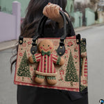 Outdoor presentation of gingerbread figure artwork with green pine trees