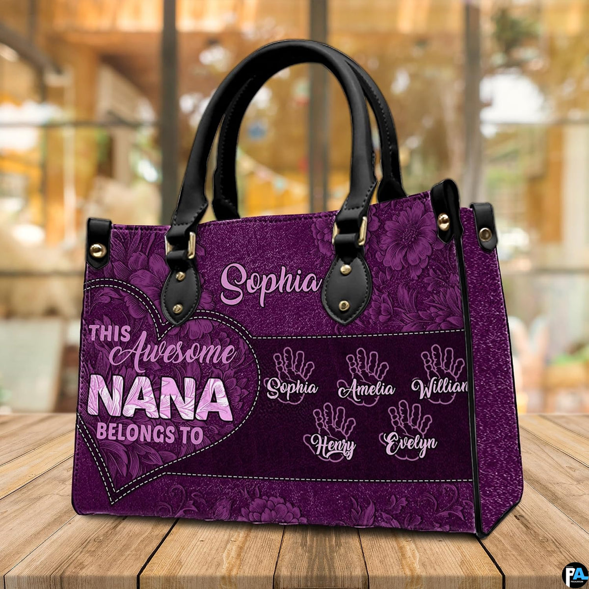 Arrangement of purple floral handbag and wallet presenting the unified botanical theme.
