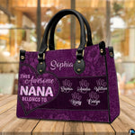 Arrangement of purple floral handbag and wallet presenting the unified botanical theme.