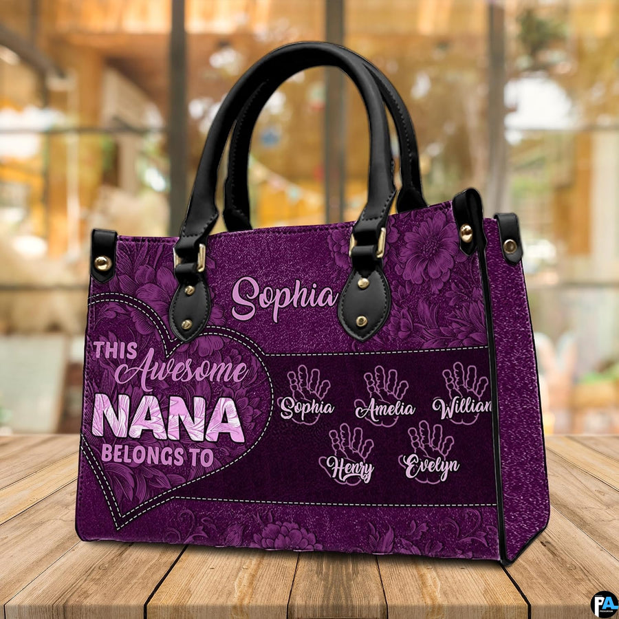 Arrangement of purple floral handbag and wallet presenting the unified botanical theme.