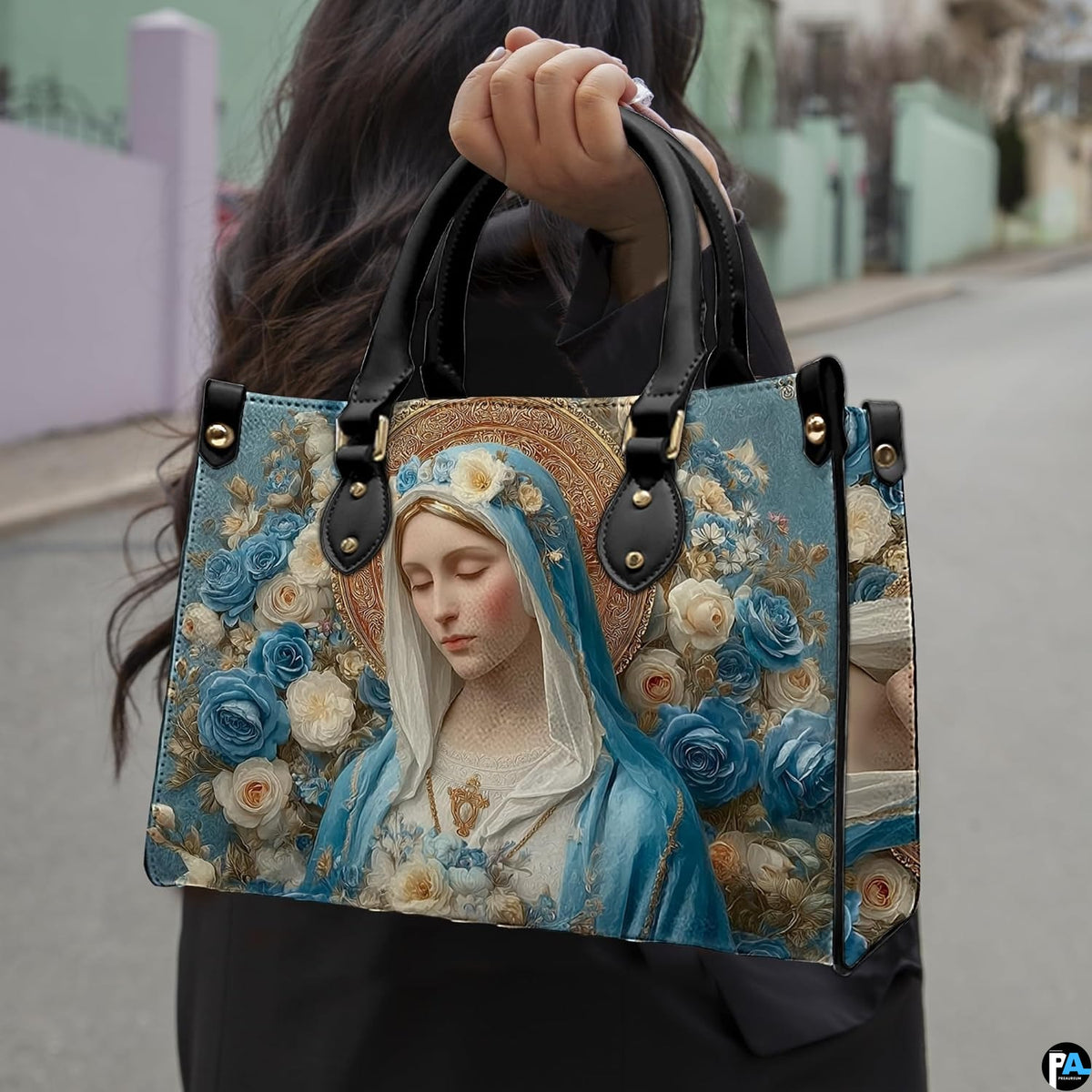 Angled view showing structured Madonna and blue roses handbag