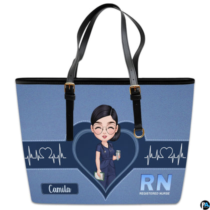 Front studio display of Denim Blue Clinician Tote Handbag featuring central heart graphic and pulse waveforms.
