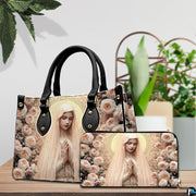 Tabletop lifestyle display showing peach rose Madonna handbag and matching wallet beside potted house plants.