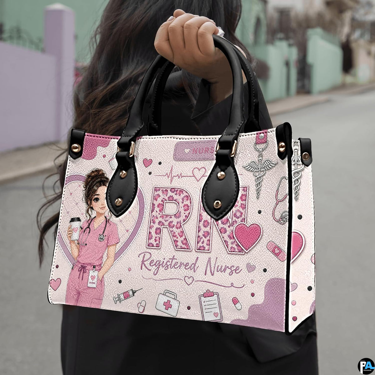 Outdoor showcase of pink registered nurse rn art held against blurred street environment.