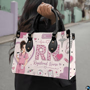 Outdoor showcase of pink registered nurse rn art held against blurred street environment.