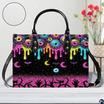 Neon eyeball slime drip handbag displayed alone on white background.