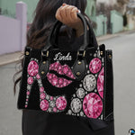 Outdoor street perspective showing glamorous pink crystal stiletto accessory carried by handle.