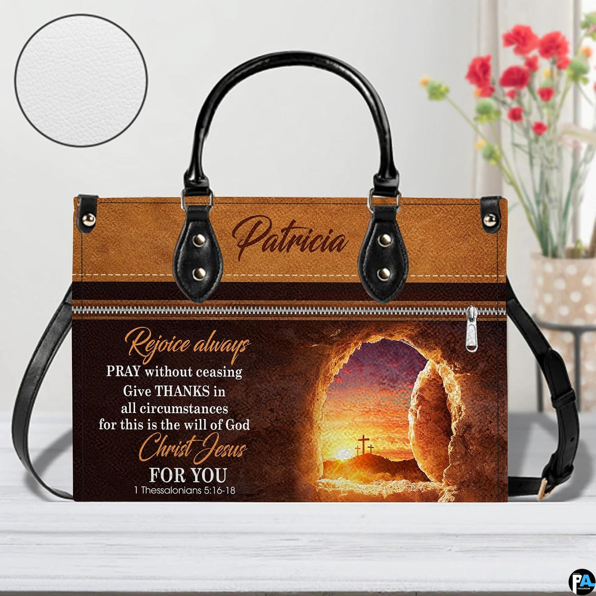 Front view of empty tomb handbag with circular textured material swatch overlay
