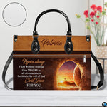 Front view of empty tomb handbag with circular textured material swatch overlay