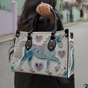 Matching zip wallet featuring the trotting filigree unicorn and purple heart medallion design.