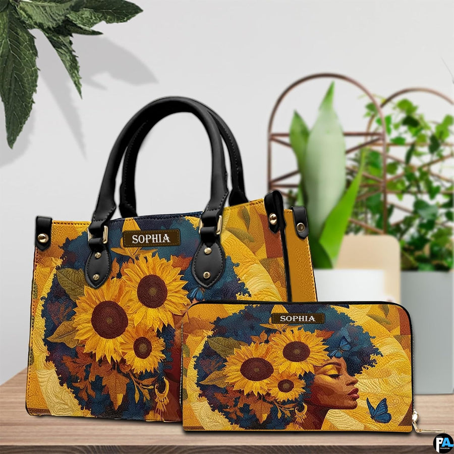 Sunflower afro profile portrait print shown beside fresh potted greenery on a rustic wooden tabletop.
