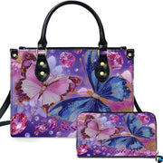 Twin crystal butterfly handbag and matching wallet set with blue and pink butterflies on lavender background.