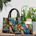 Handbag alongside matching companion piece displayed on wooden tabletop beside green plant.