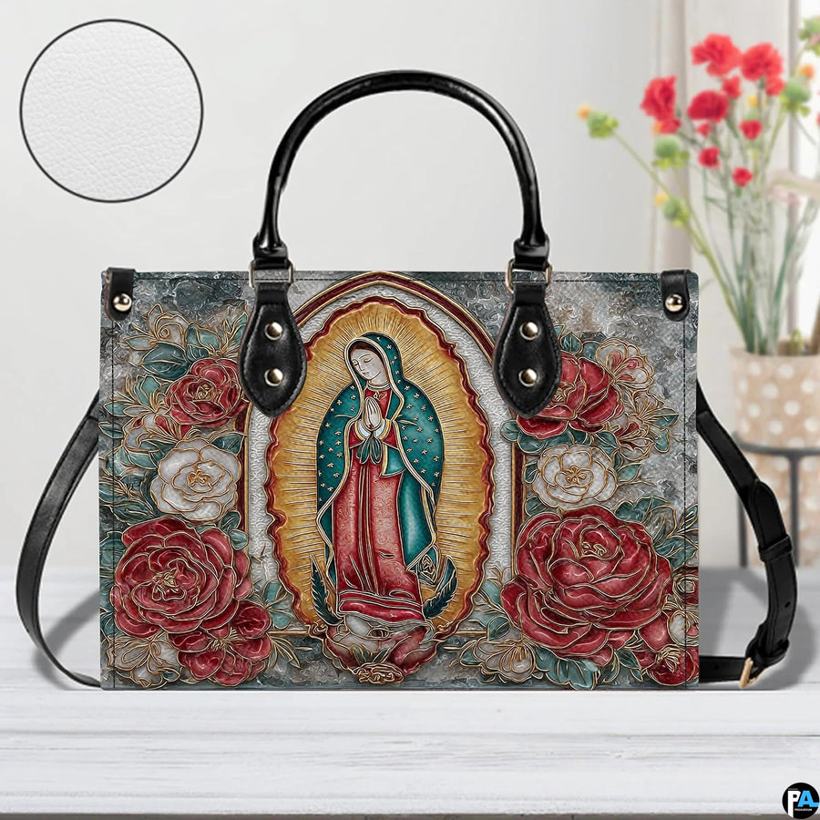 Handbag displayed outdoors in daylight showing shimmering gold filigree roses.