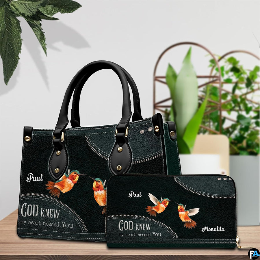 Angled display showing hummingbird couple handbag beside matching personal organizer