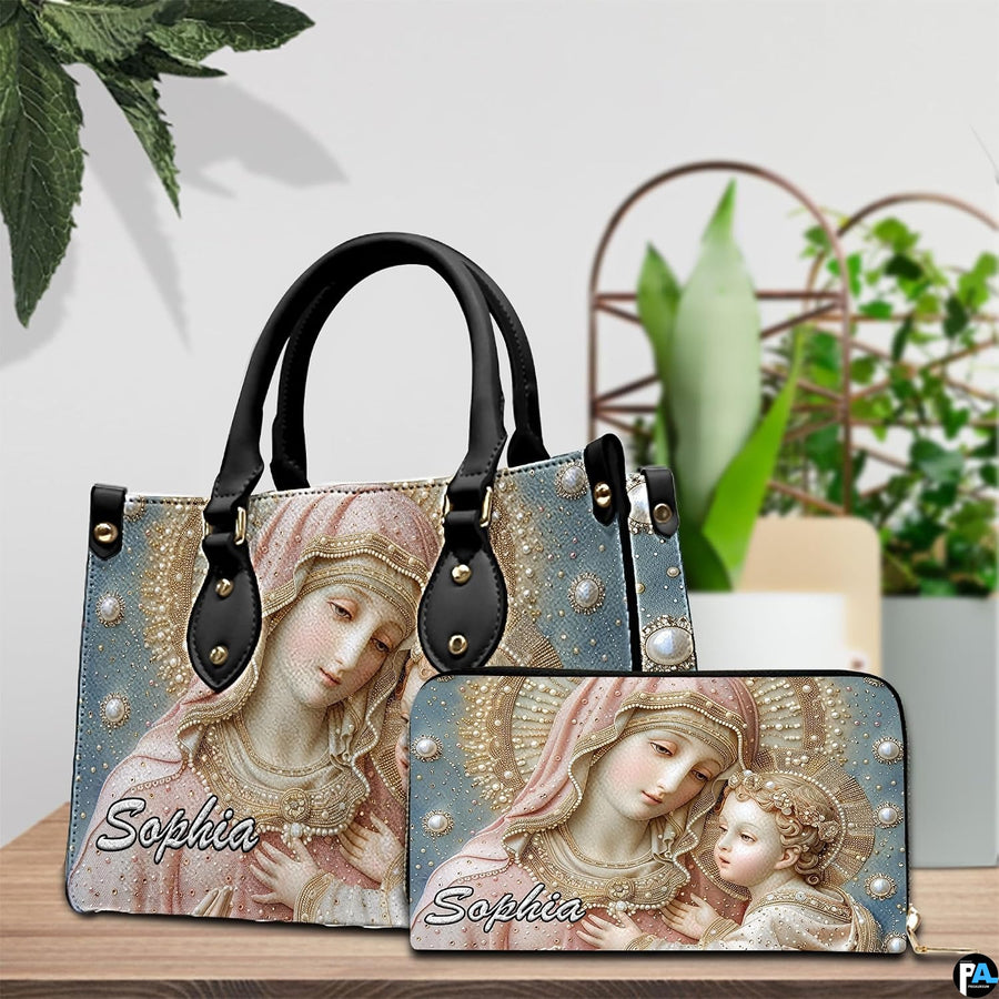 Matching Madonna and Child handbag and wallet set displayed in botanical interior