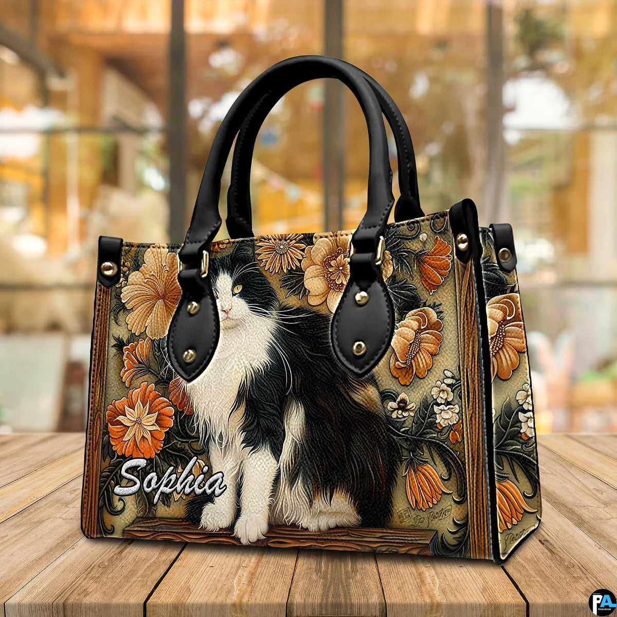 Angled view highlighting black white cat art floral motif along side profile on rustic wooden surface.
