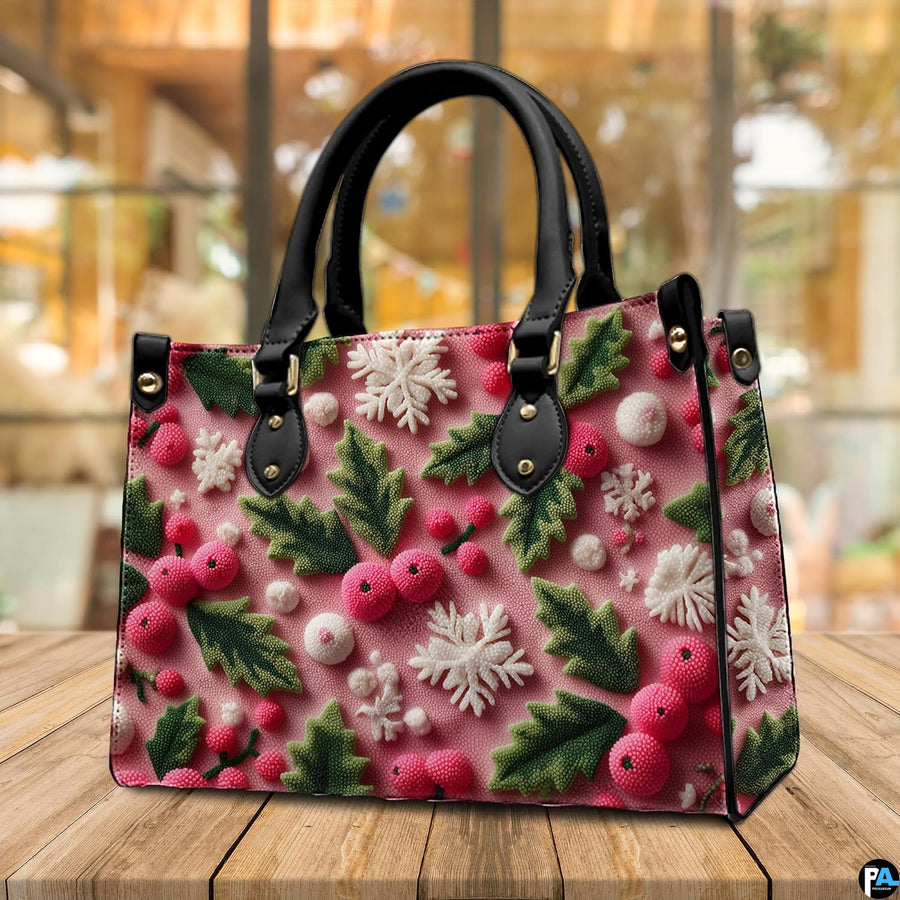Tabletop lifestyle scene displaying pink festive holly leaves and snowflakes on wooden surface
