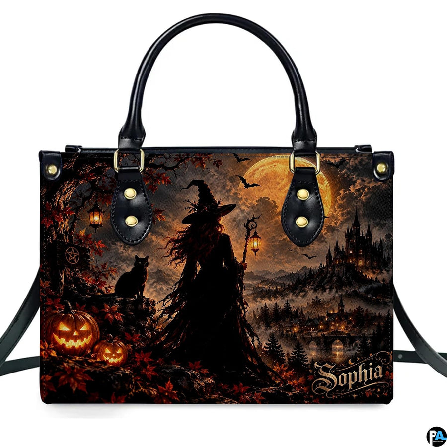 Gothic autumn witch castle harvest handbag displayed alone on white background.