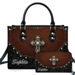 Front view of western ornate cross handbag and matching wallet with studded scalloped corner trim.
