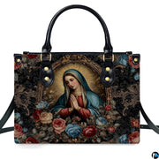 Front view of handbag featuring praying Madonna portrait inside ornate gilded oval rococo border.