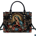 Front view of handbag featuring praying Madonna portrait inside ornate gilded oval rococo border.