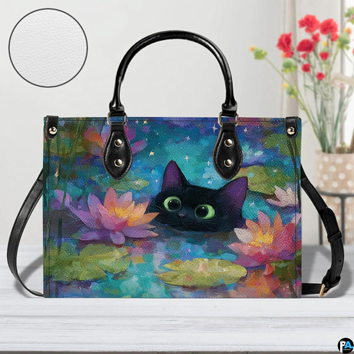 Close studio perspective of black cat water lily art positioned on white surface beside flowers.