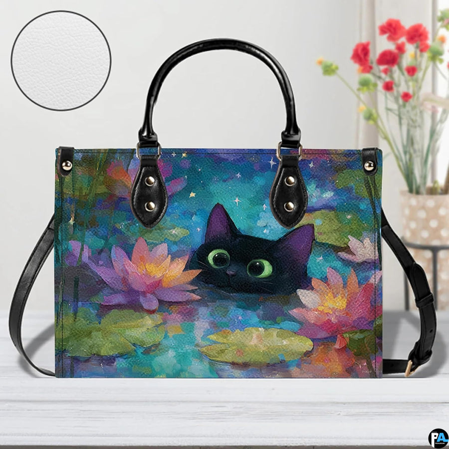 Close studio perspective of black cat water lily art positioned on white surface beside flowers.