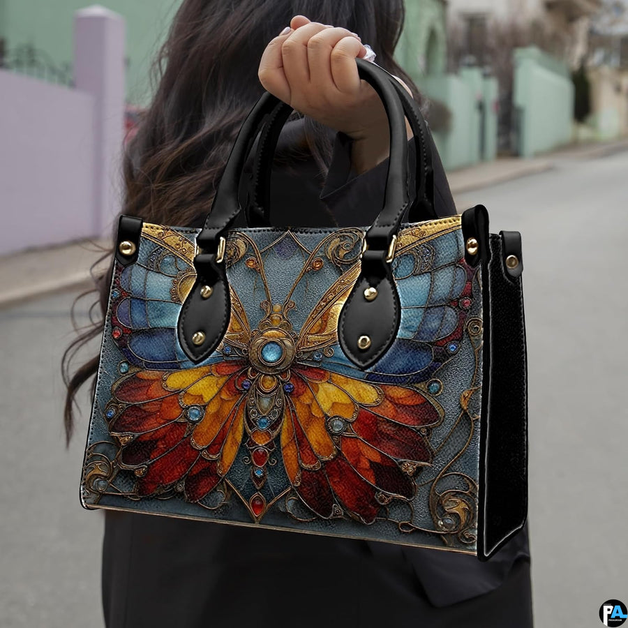 Angled view showing stained glass butterfly handbag and matching zip wallet side by side