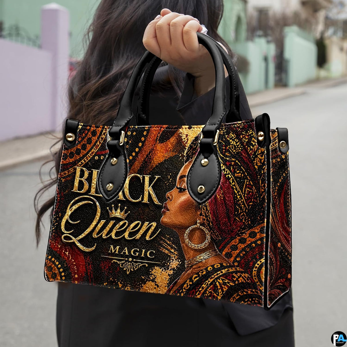 Outdoor presentation showing the burgundy gele empress artwork held by pedestrian along sidewalk.