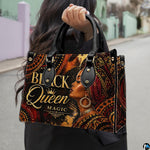 Outdoor presentation showing the burgundy gele empress artwork held by pedestrian along sidewalk.
