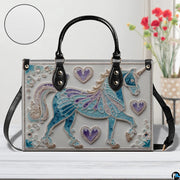 Side profile view showing structured silhouette and black carrying handles of the handbag.