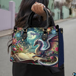 Celestial dragon handbag held outdoors by top handles displaying the vibrant moonlit garden fantasy artwork.