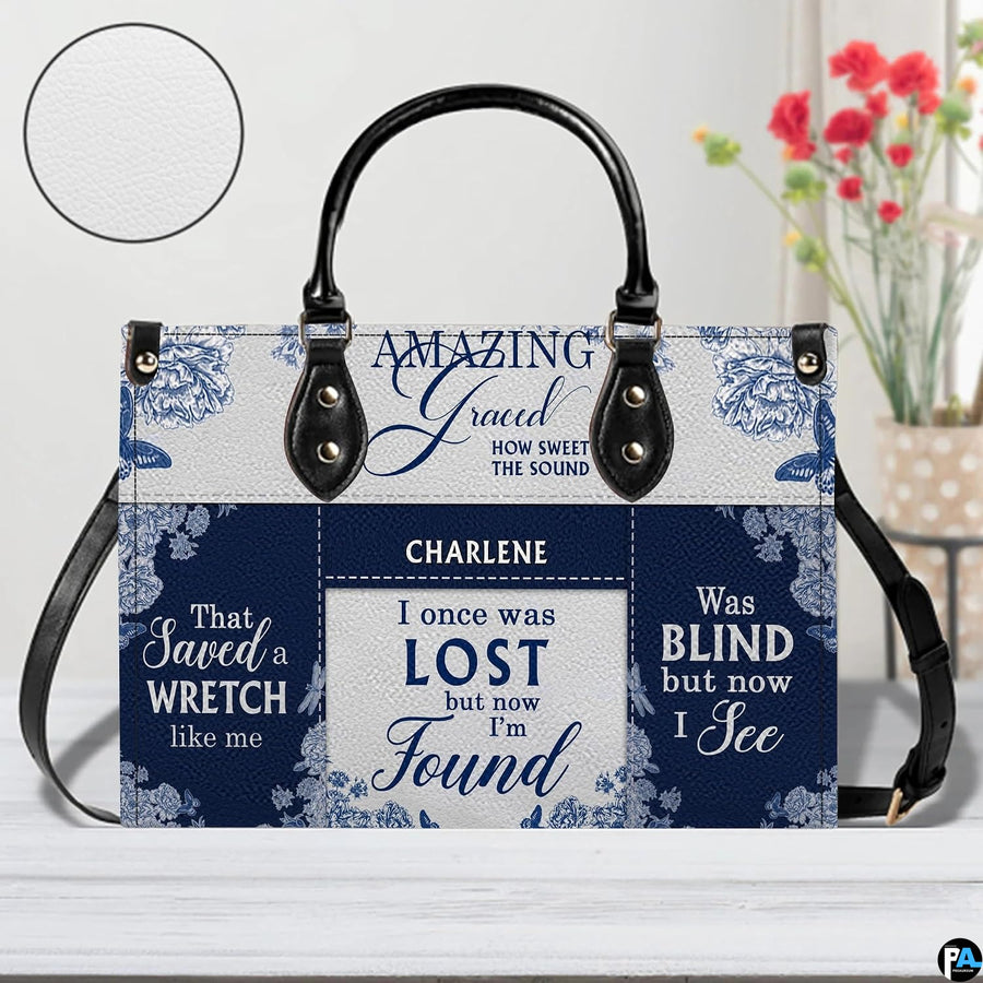 Coordinated blue floral handbag and matching wallet set on white surface