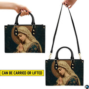 Dual carrying demonstration showing top handle and shoulder wear options for the mosaic handbag