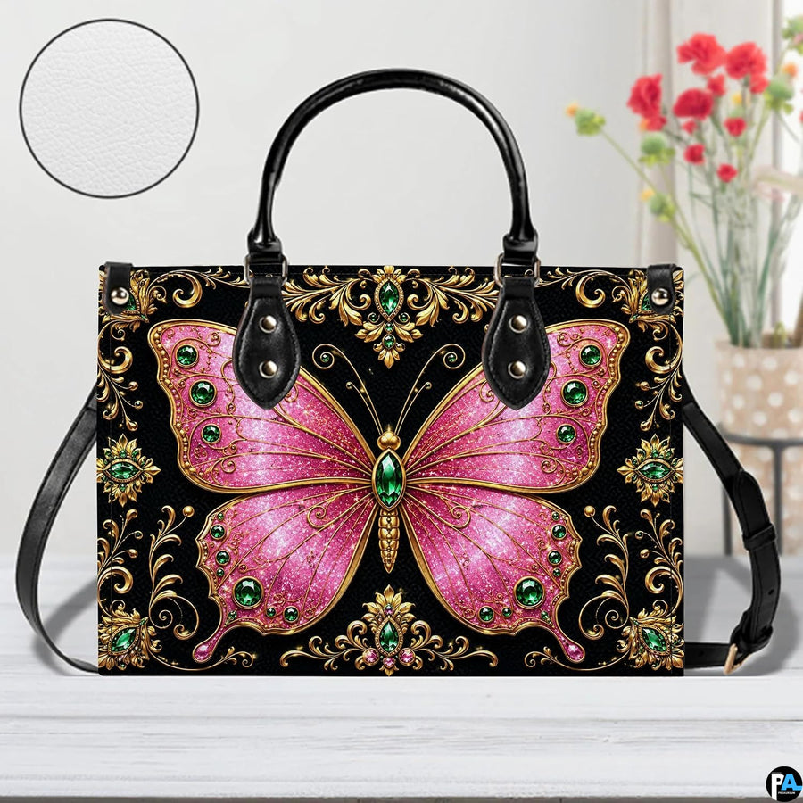 Front tabletop presentation of pink jeweled butterfly artwork placed beside floral vase and circular texture inset.