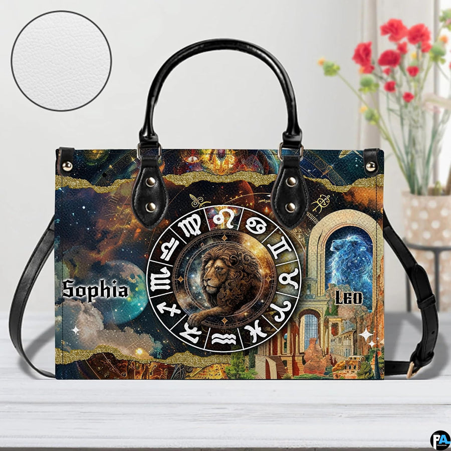 Celestial Lion Satchel Handbag resting on a white table beside floral bouquet with texture inset.