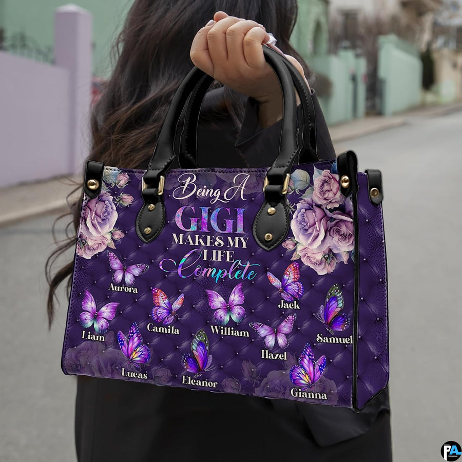 Front view of purple handbag featuring tufted diamond pattern, mauve roses, and colorful butterflies.