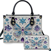 Front view of frozen crystal butterfly handbag and matching wallet set with snowflake crystal motifs.
