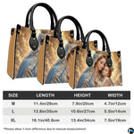Tabletop display of Madonna and Child handbag highlighting golden celestial backlighting