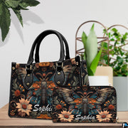 Front close-up view of handbag showing winged moth and daisies