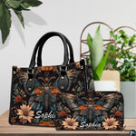 Front close-up view of handbag showing winged moth and daisies