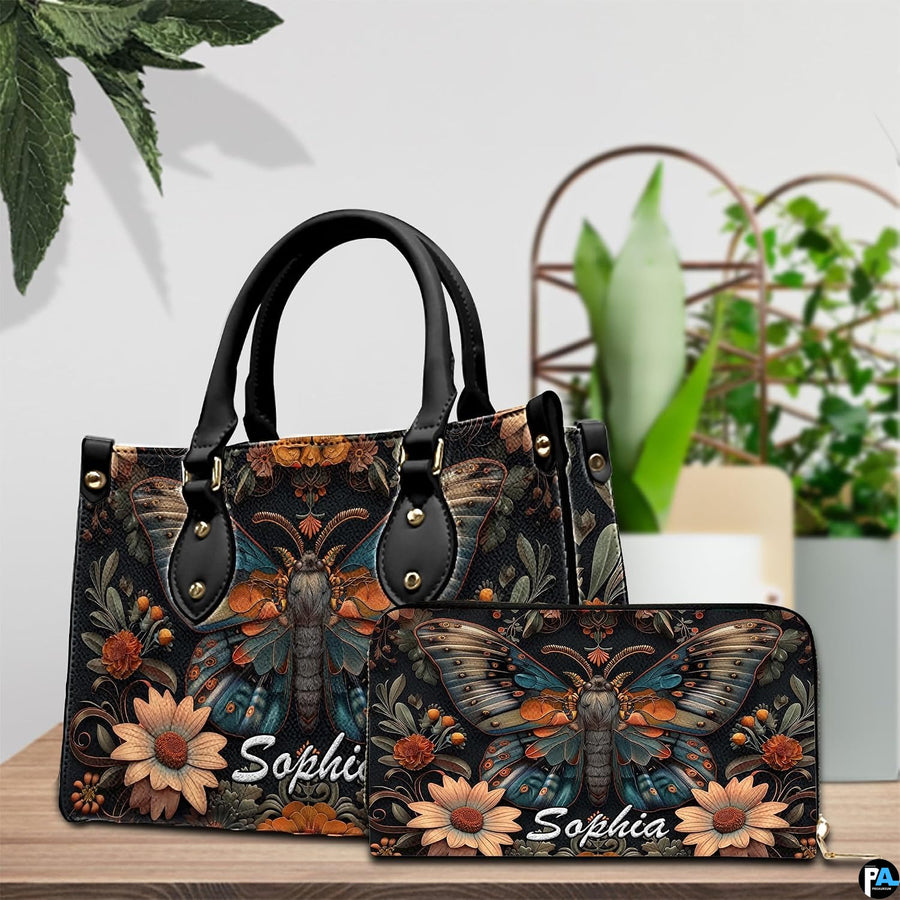 Front close-up view of handbag showing winged moth and daisies